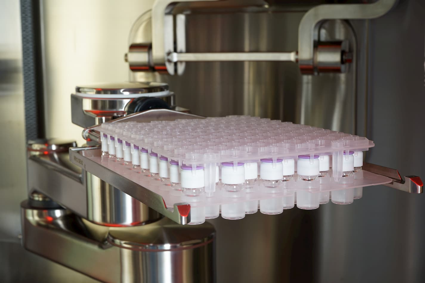 Filled and capped pharmaceutical vials in the SA25 Aseptic Filling Workcell