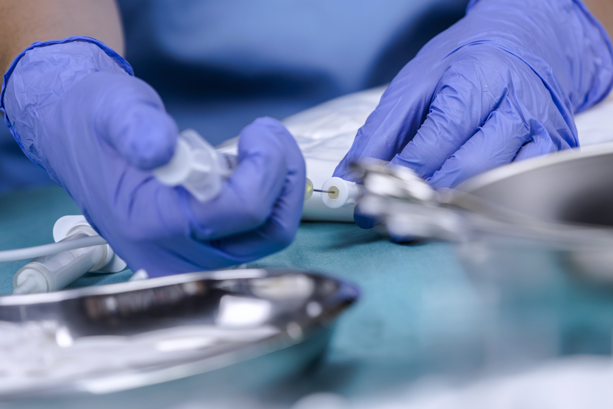 A person preparing a parenteral nutrition preparation