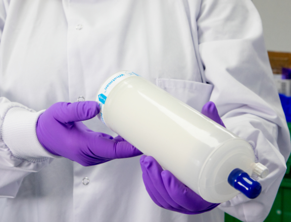 Scientist holding a Whatman capsule filter