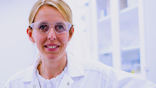 Academic research scientist white gown and glasses