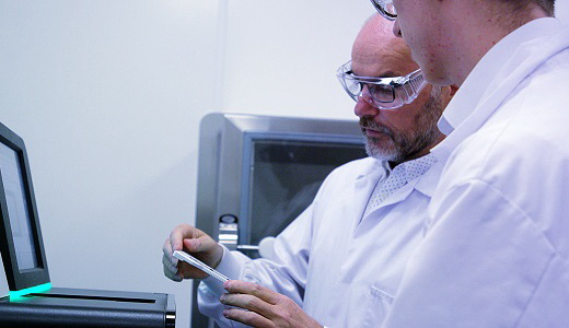 Andrew Gane discussing custom plates with colleague