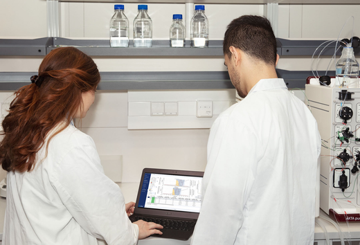 Lab scientists working with GoSIlico Chromatography Modeling Software