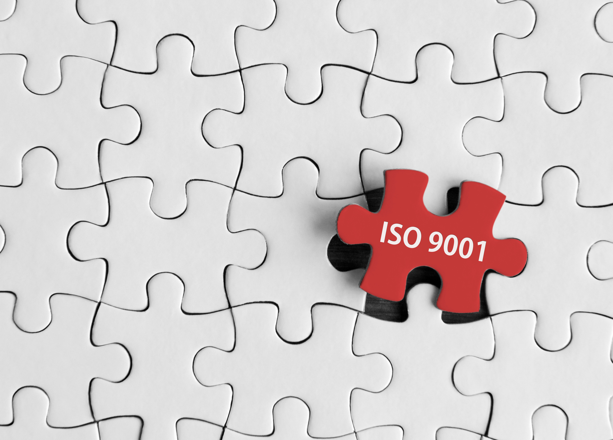 Puzzle showing missing piece with ISO 9001